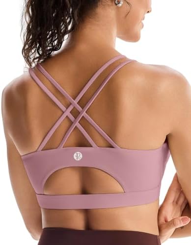 A strappy crossback sports bra in purple with removable pads and an elastic underband built for medium support.