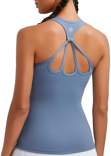 A scoop-neck yoga tank with an integrated shelf bra, molded removable cups, and an open crisscross back in light blue.