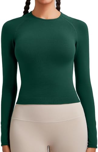 A cropped long sleeve workout top knit in a seamless round neck pattern with ribbed cuffs and a curved lower hem.