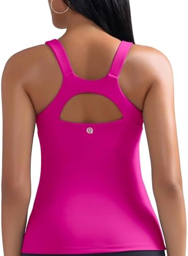 A scoop neck athletic tank with an integrated shelf bra, molded removable cups, and a criss-cross racerback strap layout.