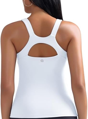 A scoop neck athletic tank with an integrated shelf bra, molded removable cups, and a strappy criss-cross racerback.