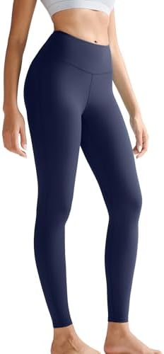 High-waisted navy compression leggings cut from soft four-way stretch fabric with side pockets and a wide waistband.