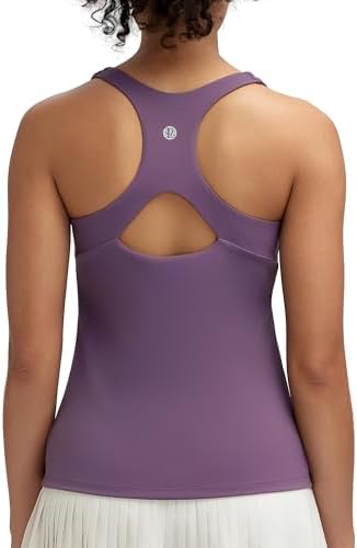 A racerback workout tank with a built-in shelf bra, removable pads, and an open droplet cutout.