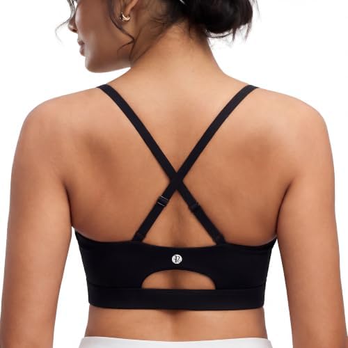 Sewn-in molded cups and adjustable crossback straps anchor this black medium-support bra for studio training and daily wear.