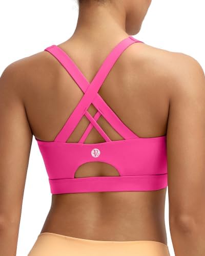 A high-impact bra with fixed molded cups, crisscross back straps, and four-way stretch Lycra in hot pink.