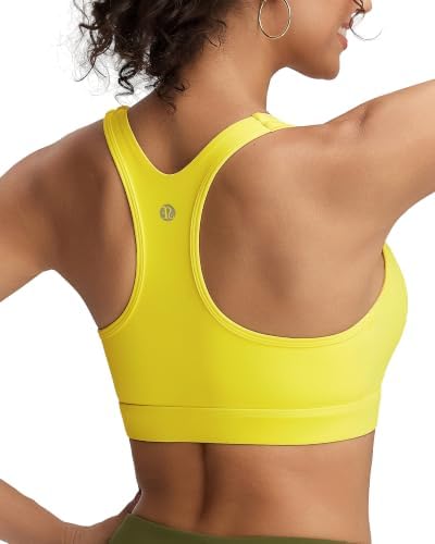 A high impact racerback bra built with fixed molded cups, wide elastic straps, and four-way stretch fabric in warm yellow.