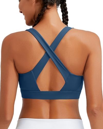 A high impact pullover bra in deep navy, built with molded cups, crisscross back straps, and stretch Lycra for running.