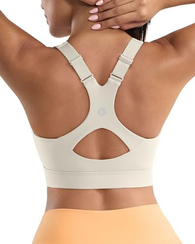 A high-impact pullover bra with sewn-in molded cups, a supportive Y-back cut, and a wide underband in warm white apricot.