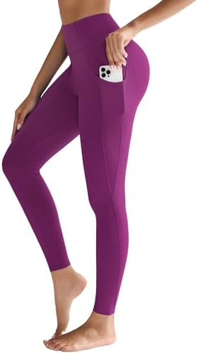 Full length workout leggings in deep purple, built with a high waistband, two deep drop-in side pockets, and a reinforced crotch gusset.