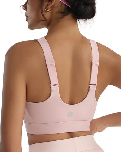 Molded cups and an adjustable racerback give this high impact bra firm hold for running, finished in clean pink.