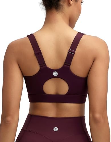 A high-impact running bra in deep maroon, built with molded cups, fixed sewn-in pads, and adjustable shoulder straps.