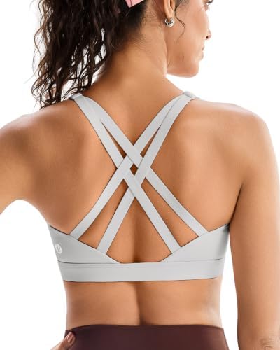 A high impact pullover bra built with sewn-in cups, wide straps, and an anchored crisscross back in cool icy grey.