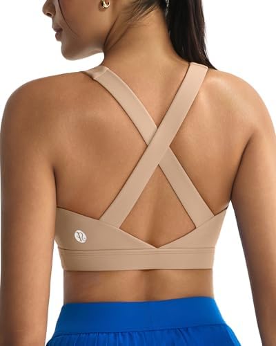 A pullover high impact sports bra in a neutral nude shade, built with sewn-in molded cups and a supportive strappy back.