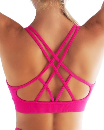A strappy crisscross back bra in hot pink, knit from four-way stretch interlock with removable pads for studio workouts.