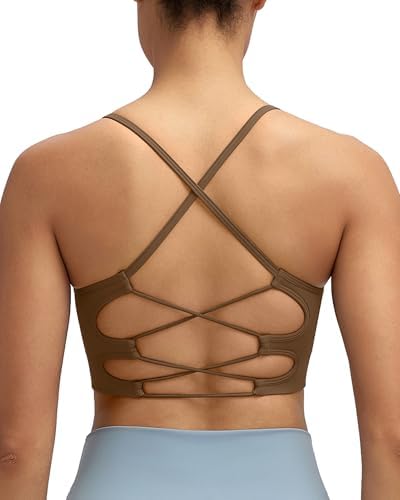 Strappy crossback sports bra in deep cocoa brown with seamless knit construction and removable cup inserts for medium support.