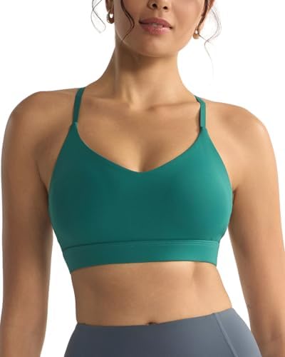A low impact V-neck bra with convertible thin straps and removable pads, sewn in a deep storm teal stretch knit.