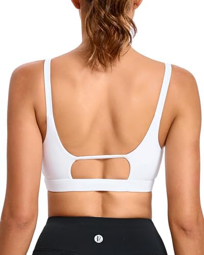 Double spaghetti straps and a clean square neckline build firm compression in crisp bright white with removable padding.