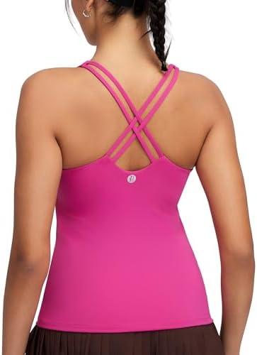 A crisscross back tank with an integrated shelf bra and removable pads, cut from high-stretch knit in deep magenta.