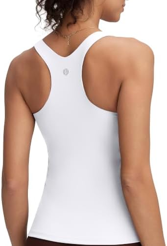 A racerback workout tank in clean white with an integrated shelf bra, molded coverage, and four-way stretch.
