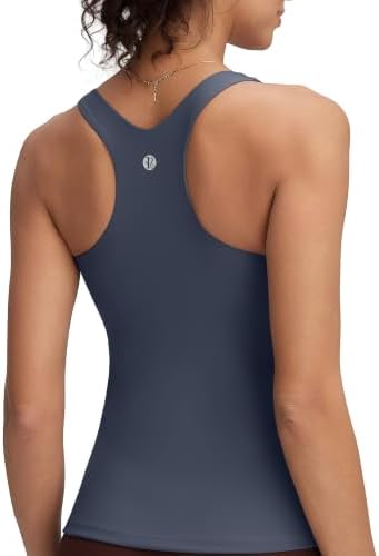 A racerback training tank in dark navy with a built-in shelf bra, removable pads, and a smooth scoop neckline.