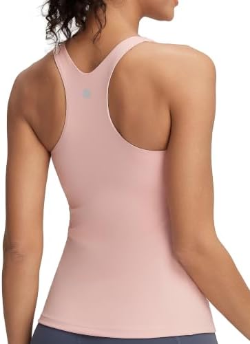 A racerback training tank with an integrated shelf bra and removable pads, sewn in flush pink four-way stretch jersey.