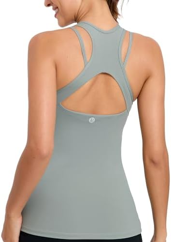 A light support workout tank with an integrated shelf bra, strappy back detailing, and removable pads in cool ice grey.