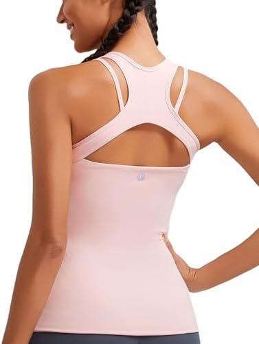 A soft pink tank top built with an internal shelf bra, removable pads, and an open strappy racerback for yoga.