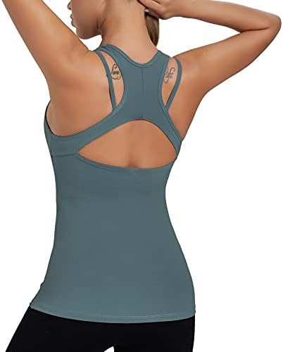 A light support workout tank in Teal Lagoon with an integrated shelf bra, strappy racerback, and flatlock seams.