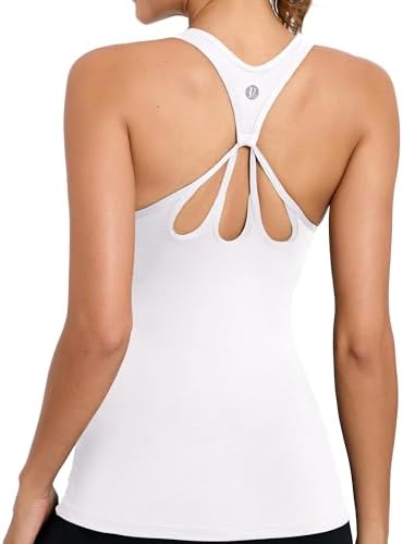 A scoop-neck yoga tank in bright white with an integrated shelf bra, molded cups, and a criss-cross strappy back.