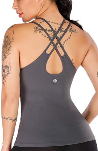 A soft four-way stretch yoga tank with an integrated shelf bra, removable pads, and an open strappy back.